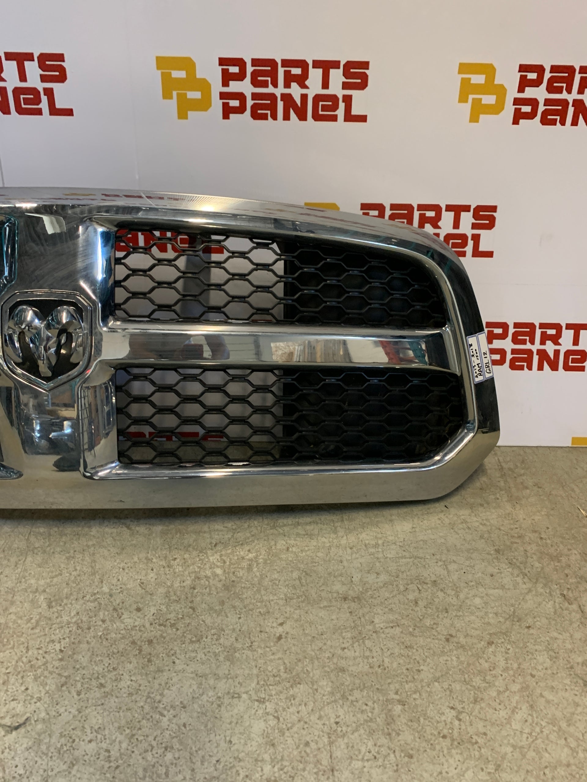 2009 - 2012 RAM 1500 FRONT OEM GRILLE WITH CHROME SURROUNDING WITH BLACK INSERT 