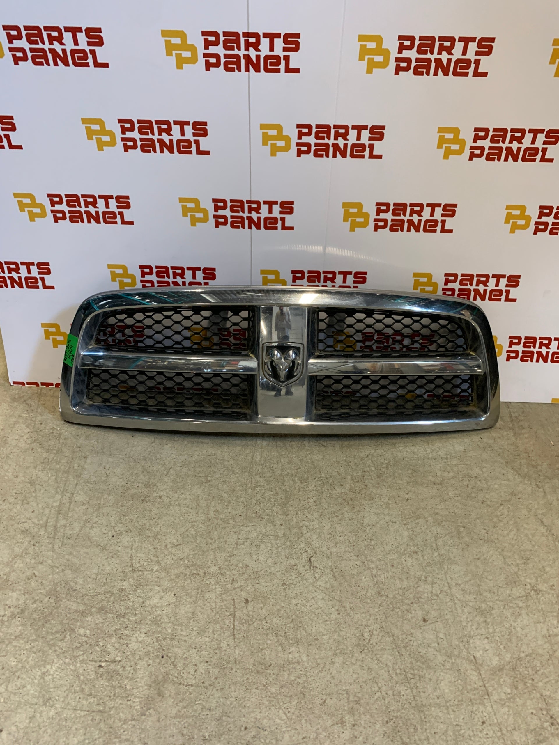 2009 - 2012 RAM 1500 FRONT OEM GRILLE WITH CHROME SURROUNDING WITH BLACK INSERT 