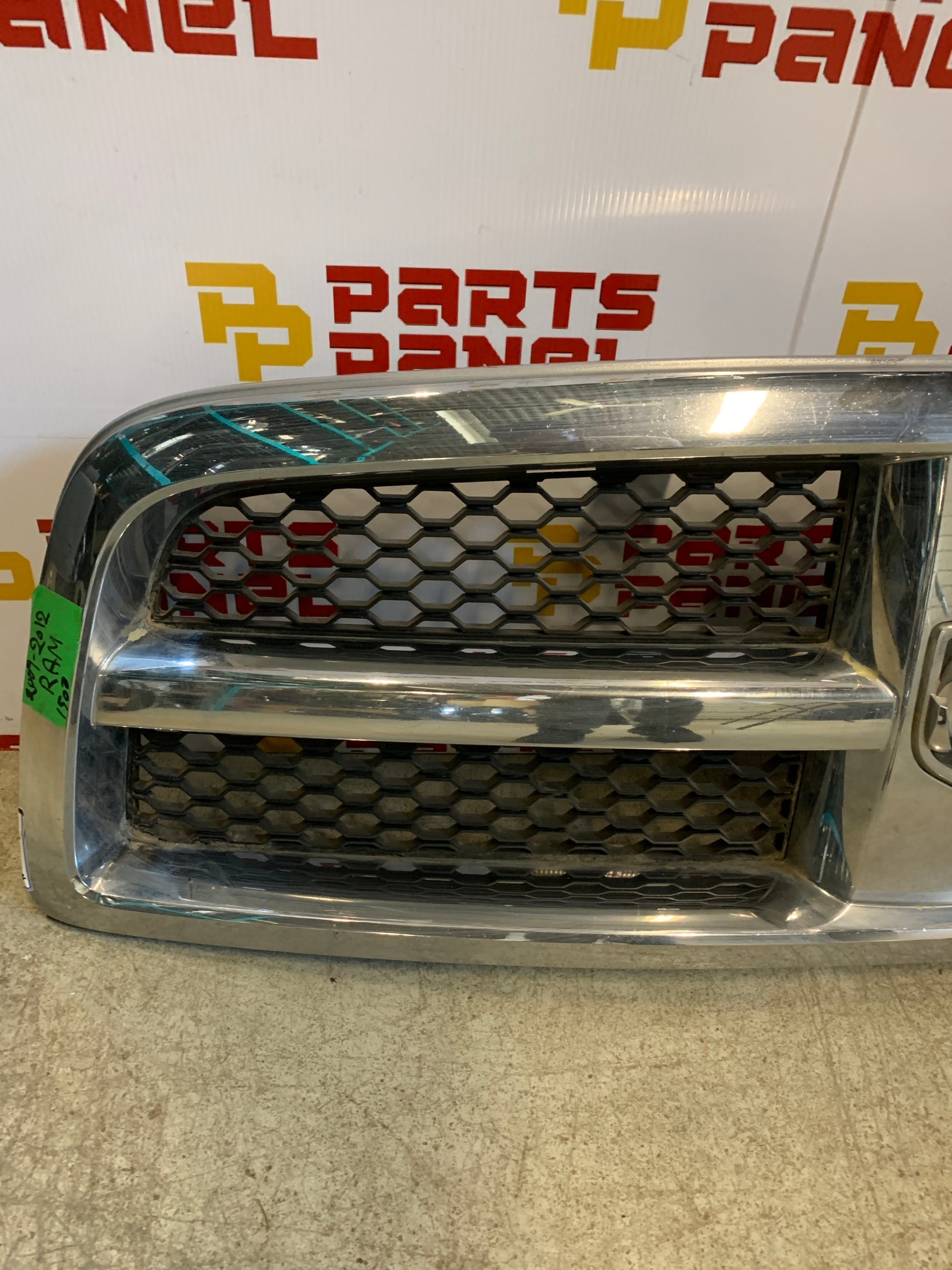 2009 - 2012 RAM 1500 FRONT OEM GRILLE WITH CHROME SURROUNDING WITH BLACK INSERT 